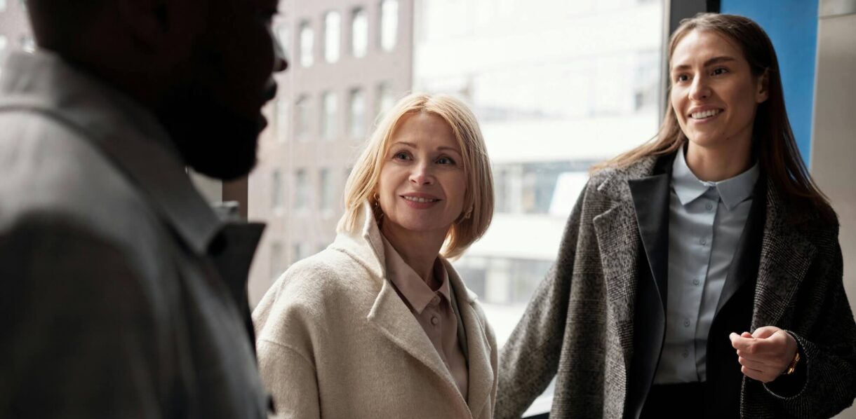 Three people standing together.