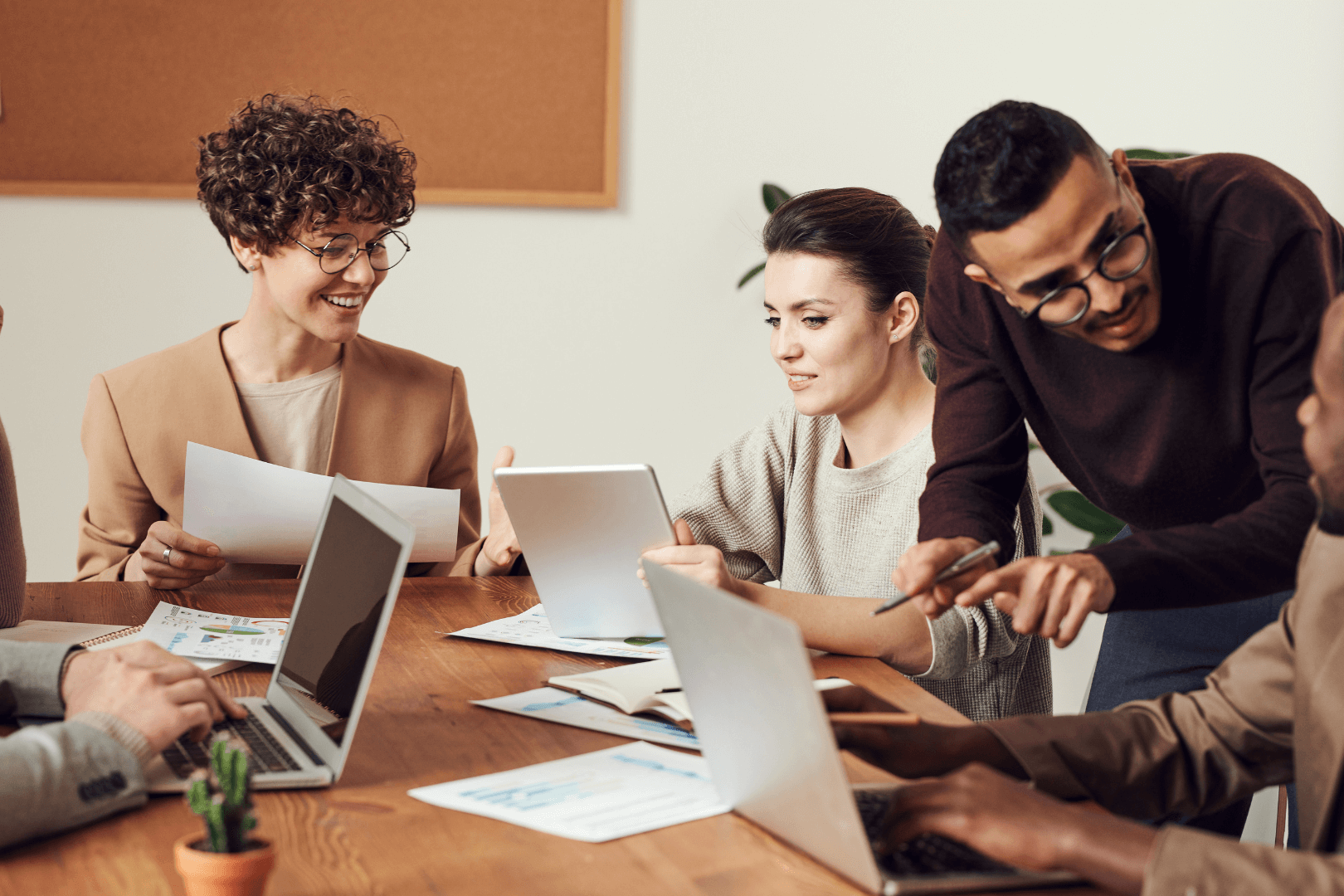 People having meeting in the office looking happy